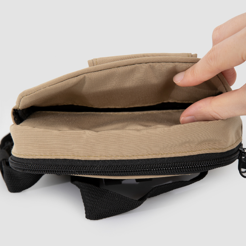 Open zipper compartment on dog treat training pouch