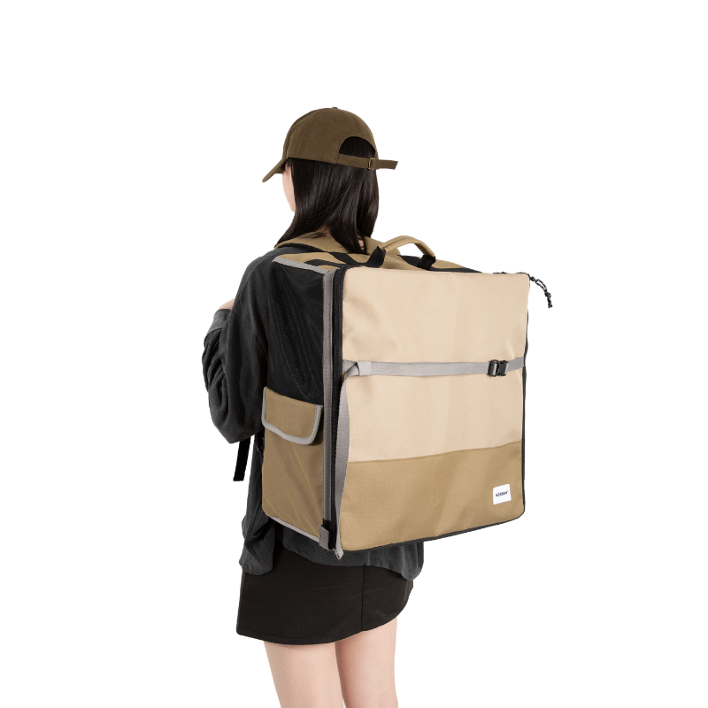 Beige 2-in-1 pet car seat and backpack carrier worn on back outdoors