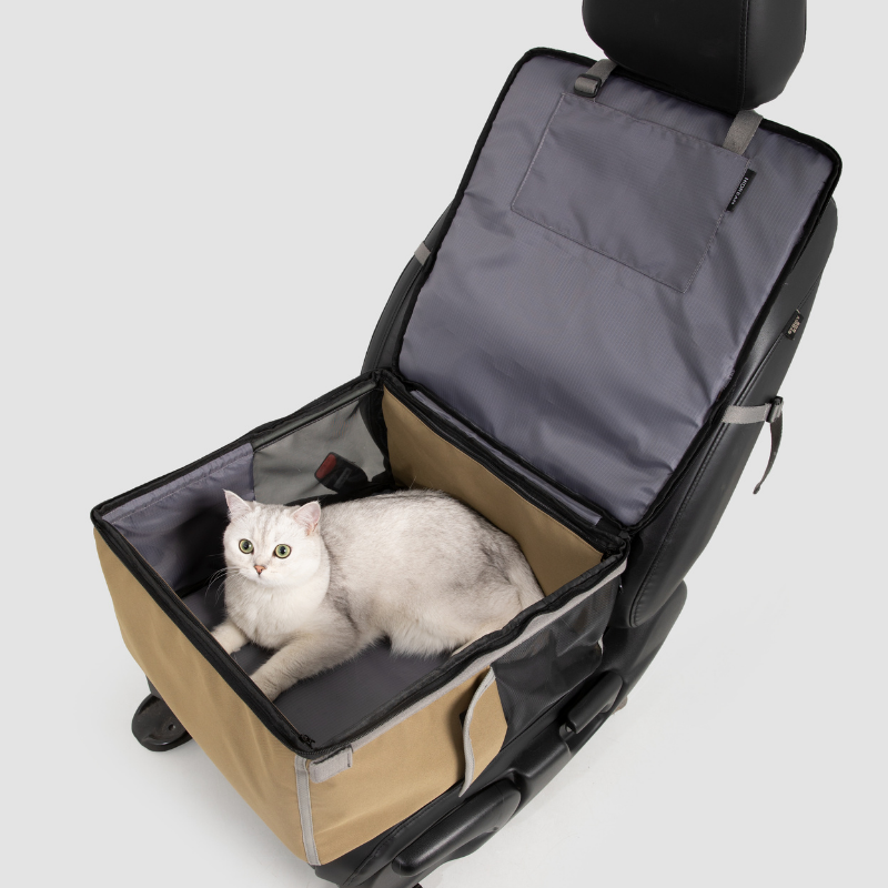 Beige 2-in-1 pet car seat carrier opened on seat with white cat inside
