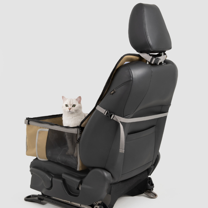 Beige 2-in-1 pet car seat carrier secured to front car seat with white cat inside