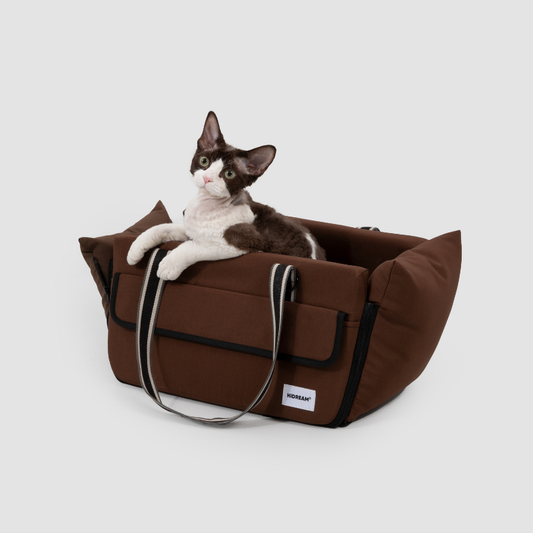 Brown center console pet car seat with cat resting on cushion