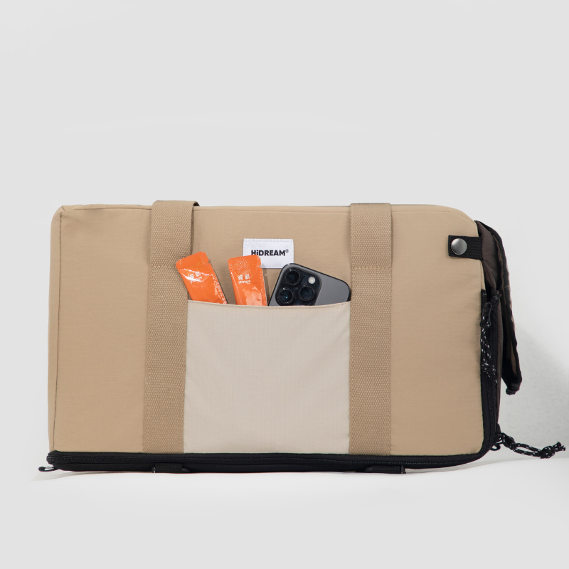 Storage pockets on beige breathable center console pet car seat