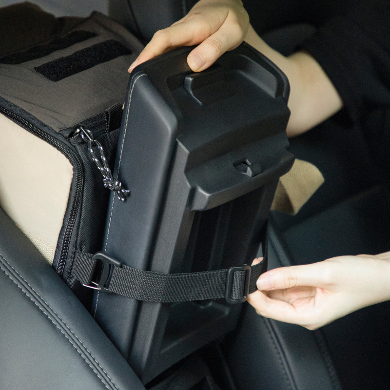Close-up of center console pet car seat strap secured inside car