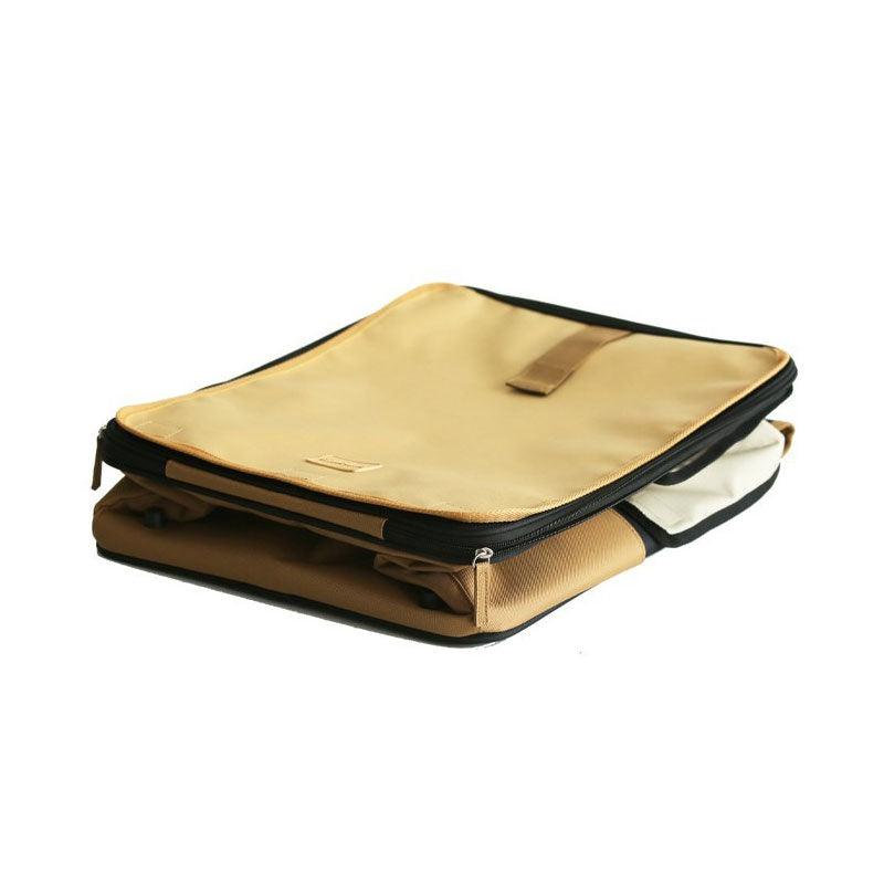 Folded black and beige roll-up cat carrier bag