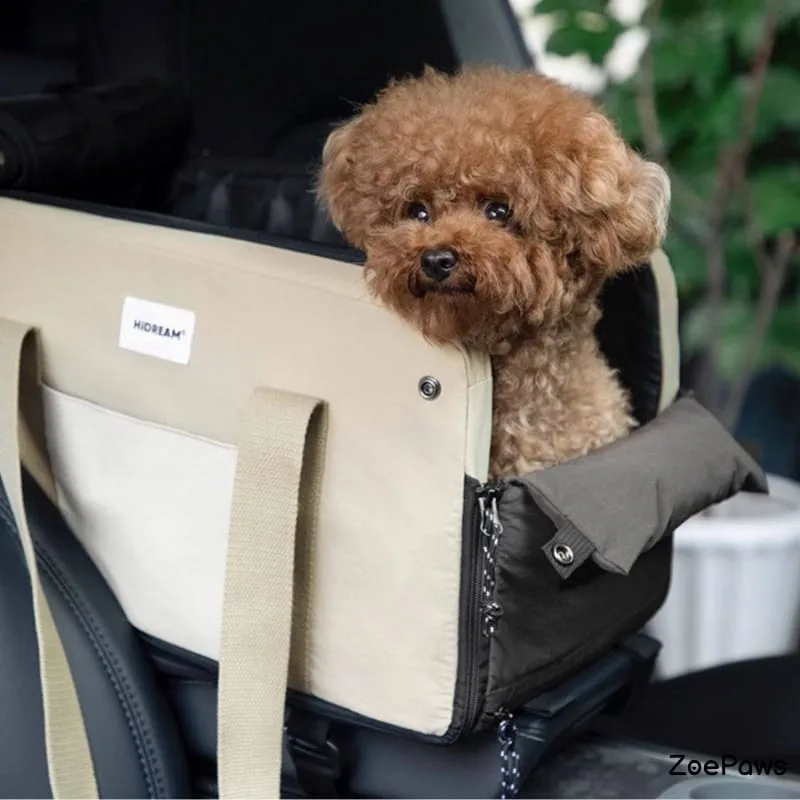 Brown poodle sitting in HiDREAM beige pet car seat carrier on vehicle seat