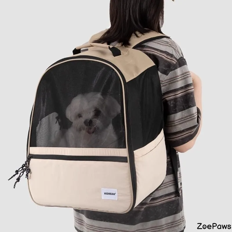Small white dog inside HiDREAM mesh pet carrier backpack worn by person in striped shirt